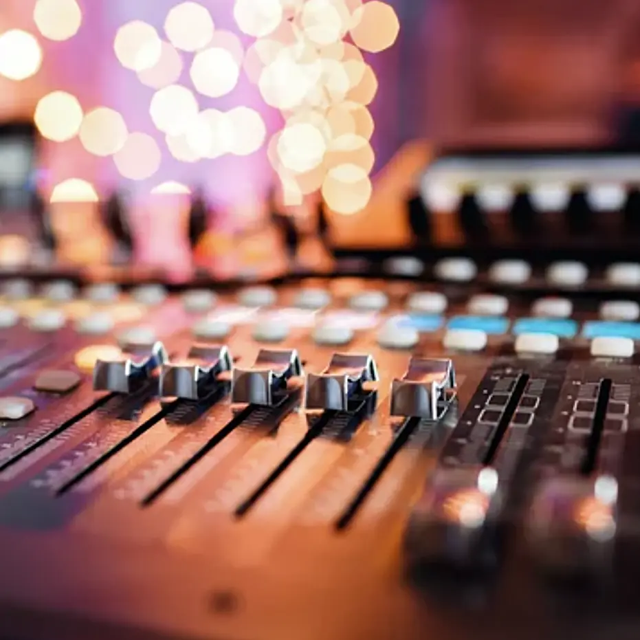 Image of an audio mixing board.