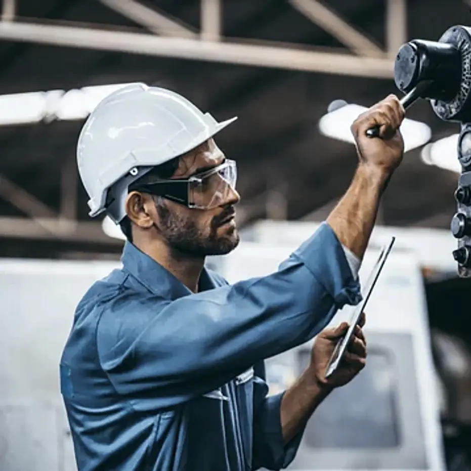 Image of a mechanic fixing something.