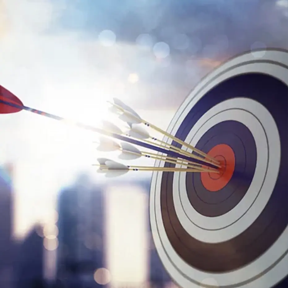 Image of a target with arrows hitting the center bullseye.